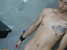 Young Asian boy with a big cock pleases himself while in bondage.