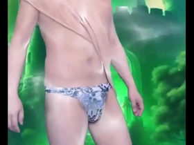 His dancing is very sensual and he moves with the grace of a cat, a male stripper dancing outside.