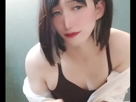 A feminine-looking male in Japanese attire engages in sexual activity.