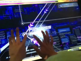 A young Japanese man enjoys playing a porn video with unlimited replays.