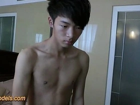 Small Asian boy masturbates after taking a shower.