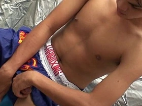 Gay Asian twink masturbates in video.
