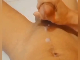 Young Asian man masturbates and ejaculates.