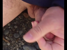 Japanese gay masturbates outdoors on the beach and ends up in a facial.