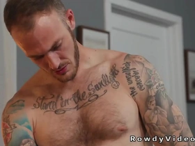 Muscular men engage in gay sex with blowjob and anal sex with cum inside on the set.