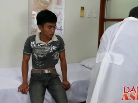 Young Asian twink gets an internal examination from a gay doctor.