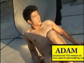 Adam, the Asian hunk showing off his muscles.