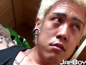 A blond Japanese twink enjoys anal play and masturbates.